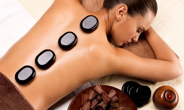 beautiful-woman-relaxing-in-spa-salon-with-hot-sto-2021-08-26-18-24-39-utc